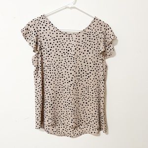 Tan and black polka dotted shirt with ruffle sleeves